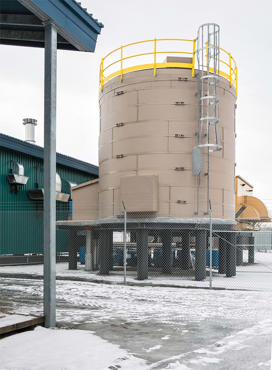 The water storage tank for the fire-suppression system at the Kwethluk K-12 School is perched atop a steel piling to keep it above any seasonal flooding.