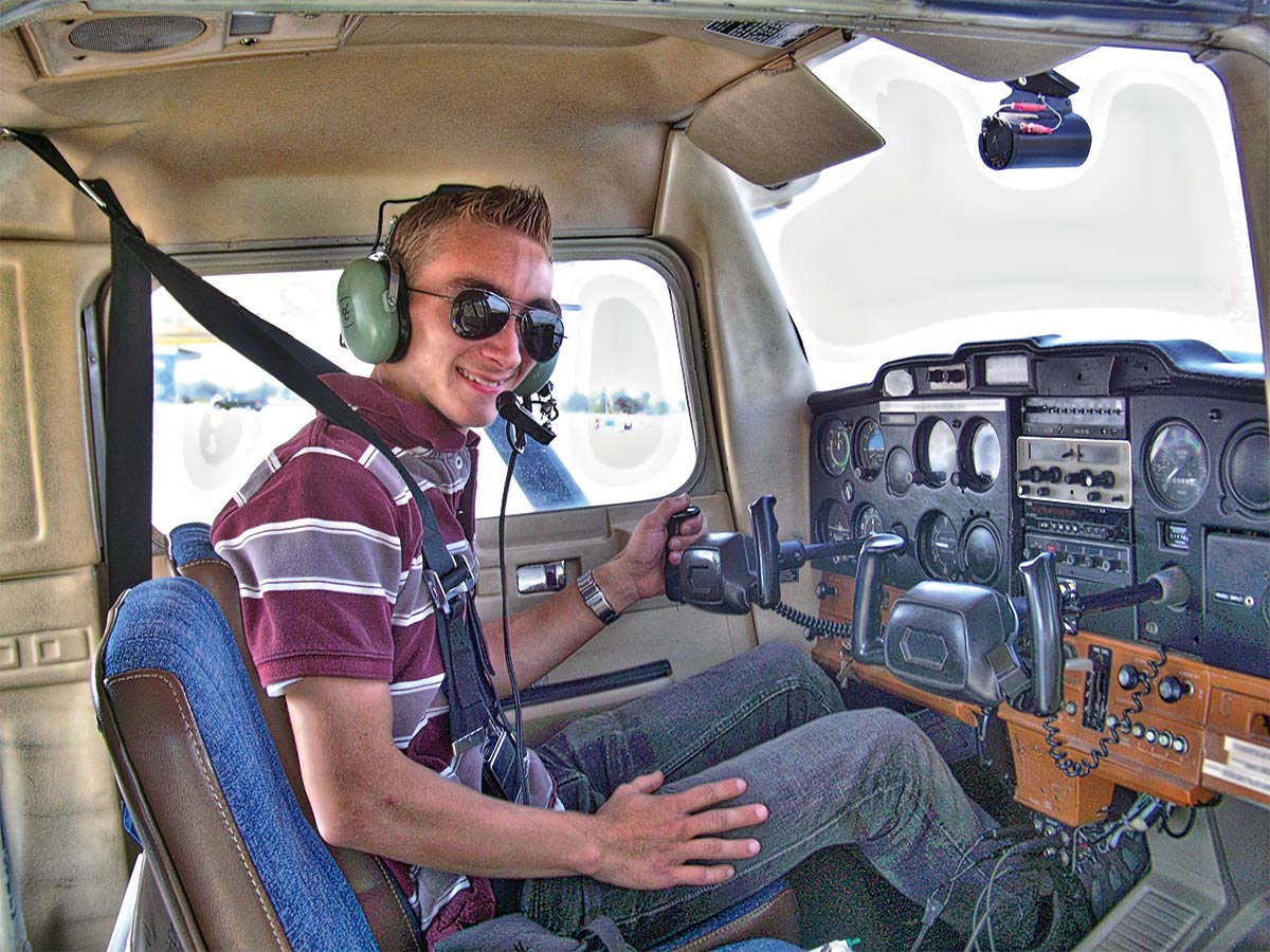 Drew Bryant, an Alaska Bible College graduate, prepping for take-off in a Kingdom Air Corps aircraft.