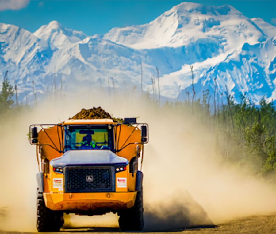 Airport Equipment Rental truck with mountains in the background