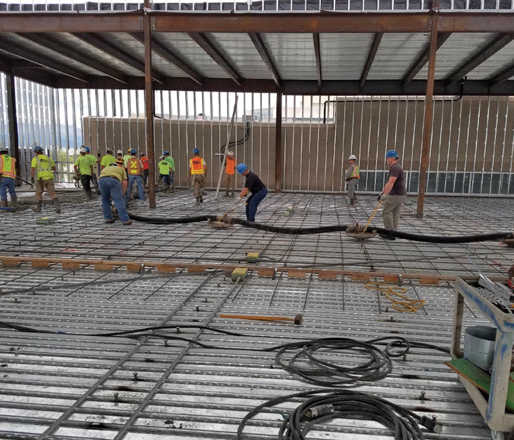  Concrete crews work in synchronization to complete the floor decks at the Anchorage Museum Expansion