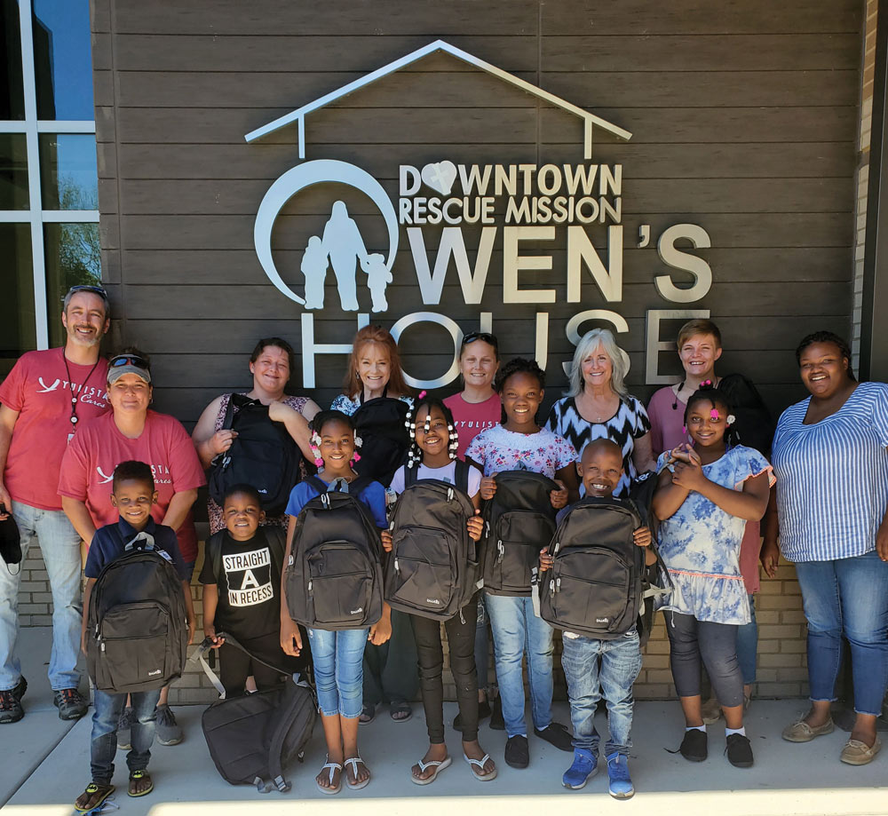 Yulista employees donated 100 backpacks with school supplies to the Downtown Rescue Mission in Huntsville, AL.