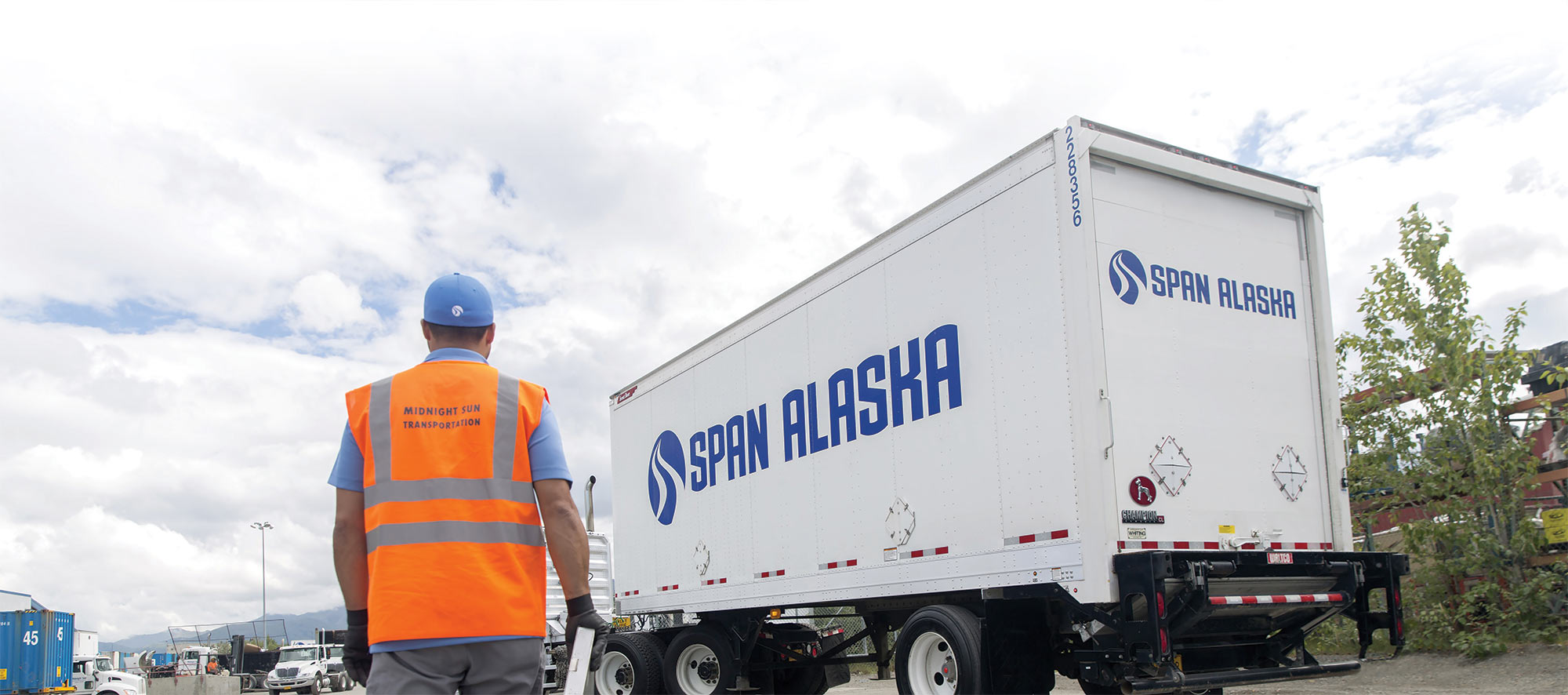 Span Alaska truck with worker walking towards