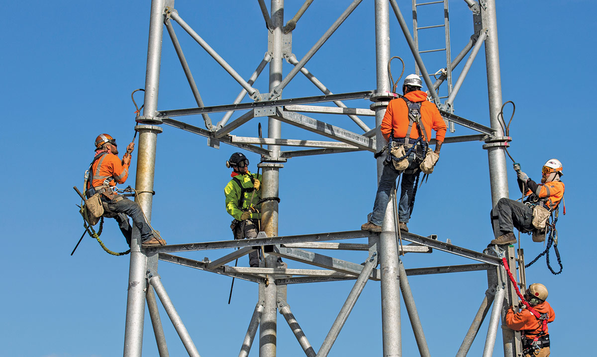 Workers working on cell tower equipment near Kotzebue