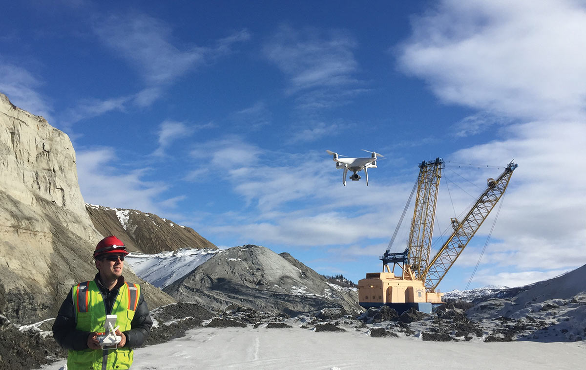 Alex Legrismith, an engineer for Usibelli Coal Mine flying a drone