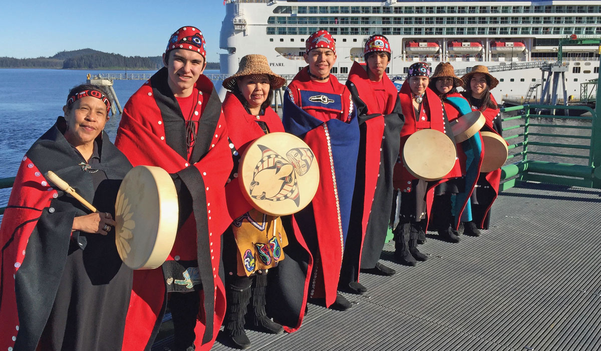 Traditional Tlingit drummers greet cruise ship visitors at Icy Strait Point, the only Alaska Native owned and operated port in the state