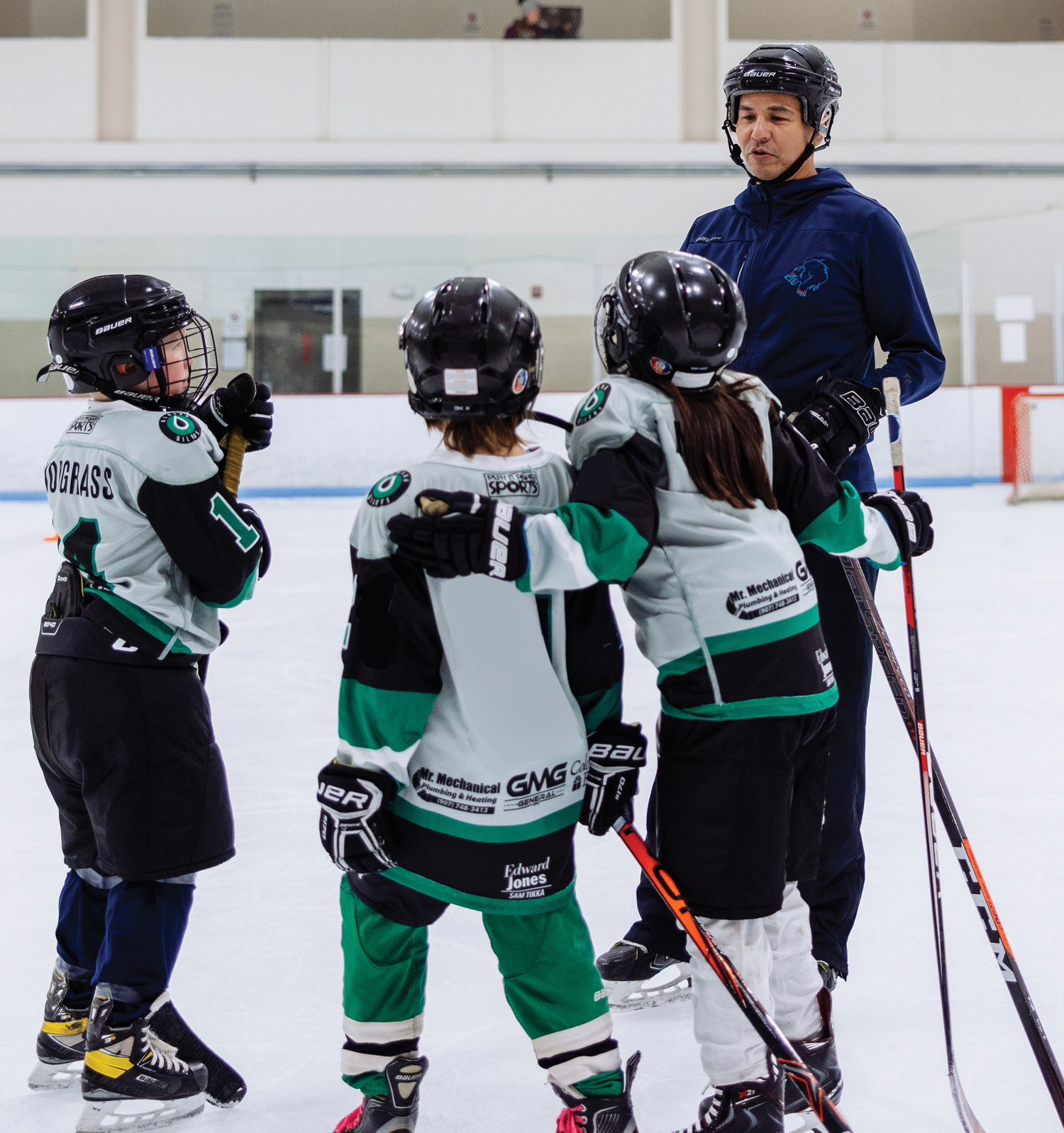 Aaron Schutt teaching kids hockey
