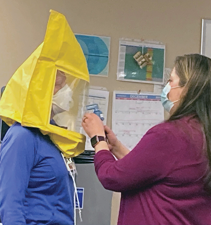 Providence Alaska Medical Center workers testing the fit of new N95 masks