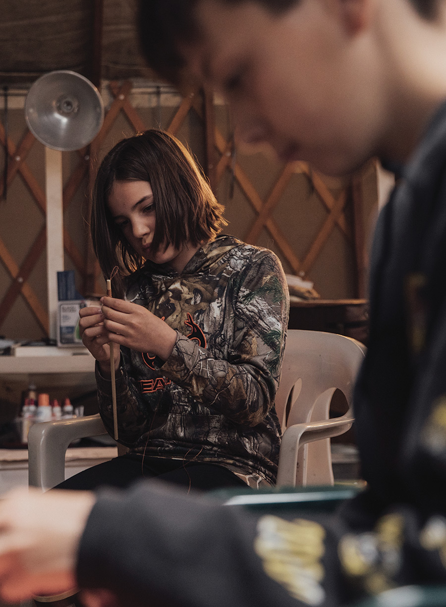 young girl and boy working on arts and crafts