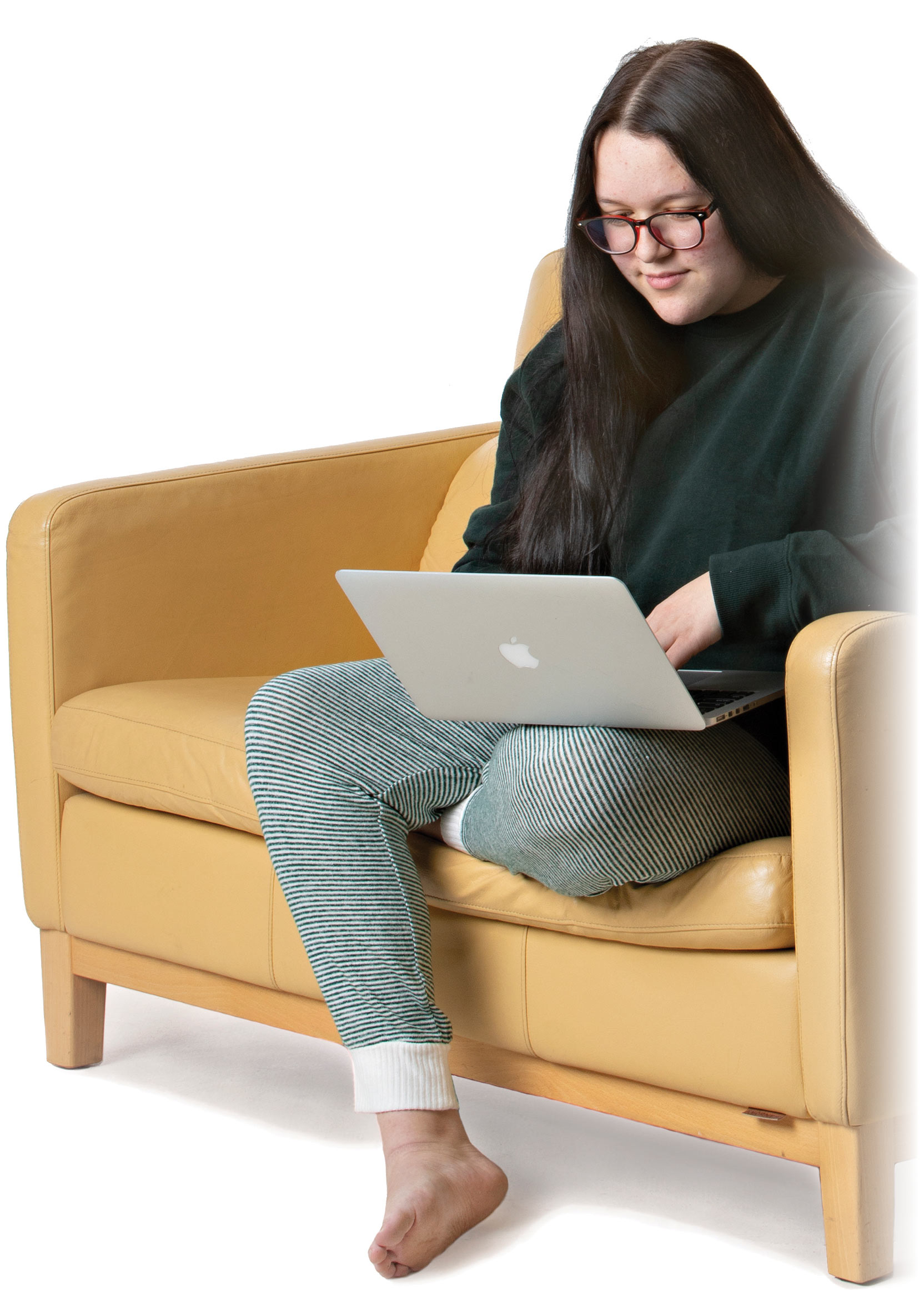 girl on couch with laptop