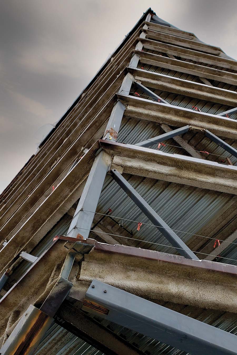 The “prow” splits below the second floor into a nearly horizontal beam (lower right), designed only to carry wind stresses, and the “Jenga Column” (lower left) which holds most of the weight. If it ever fails, the “belt trusses” (middle right) can redistribute the load.