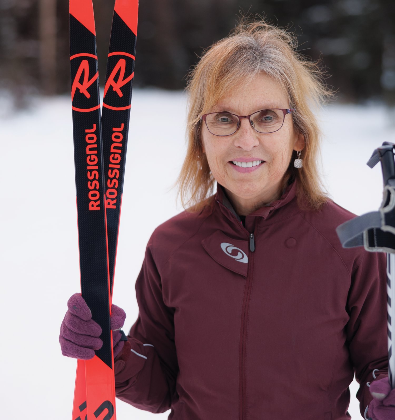 Sandra Blinstrubas holding skis