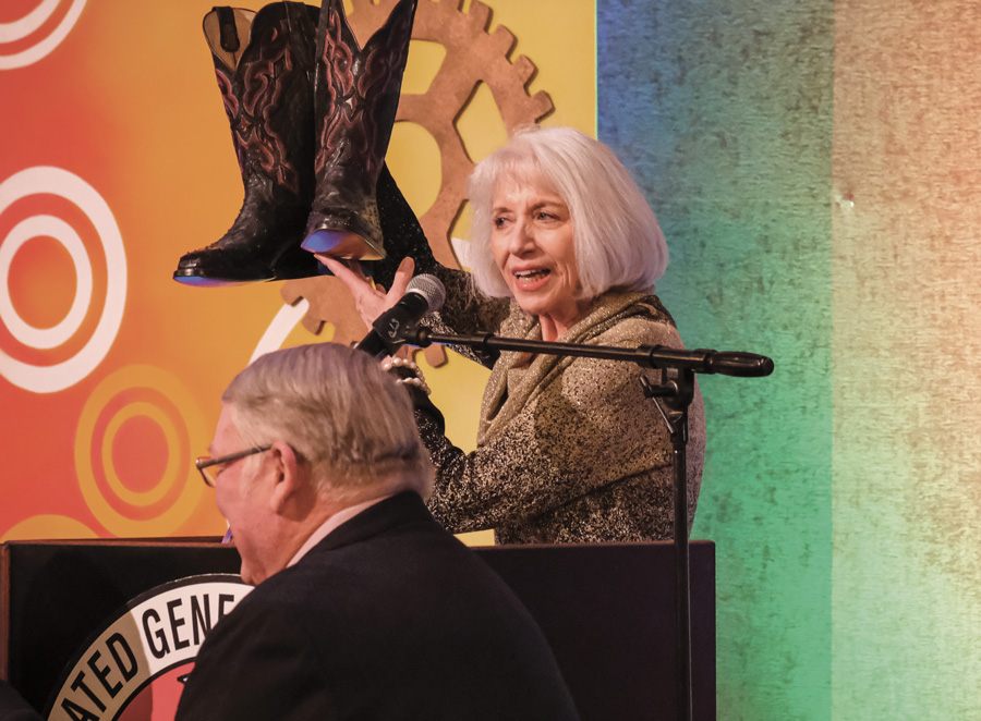 Lynn Ann Eng brought a pair of her late husband’s size-14 boots to accept the 2020 Hard Hat award on behalf of C. John Eng.