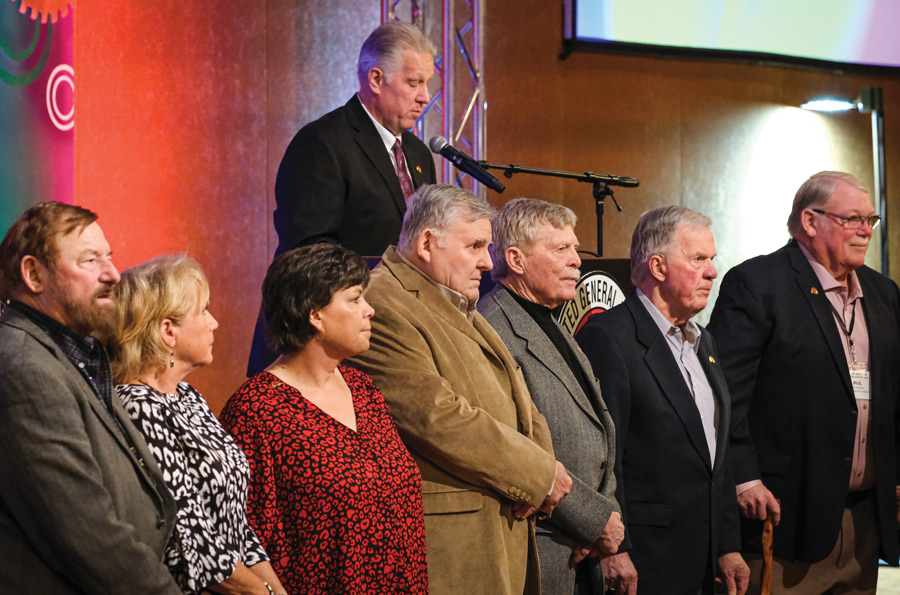 Past Hard Hat honorees line up for the presentation of two new awards.