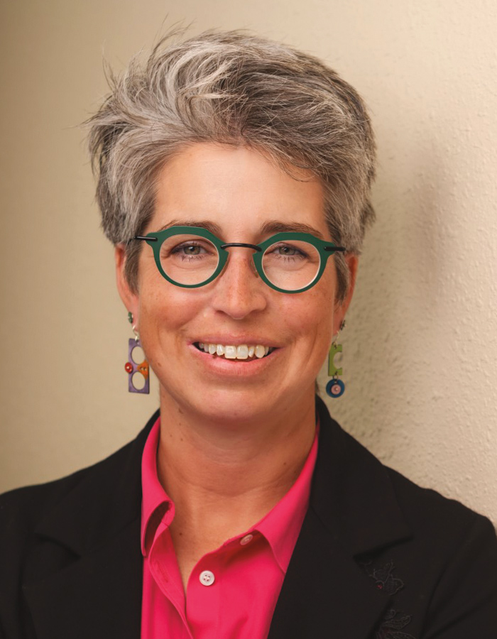 A headshot photograph of Jennifer Bundy-Cobb smiling (Managing Partner at Wilson Albers)