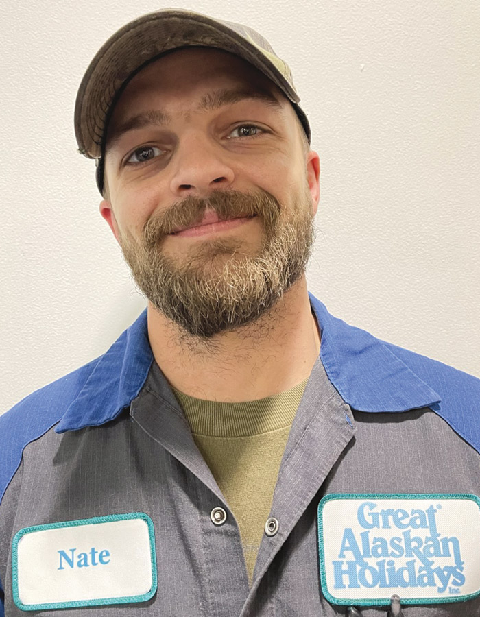 A headshot photograph of Nate Solomon grinning (RV Technician at Great Alaskan Holidays)