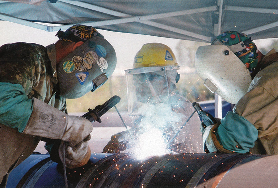 group of people welding together
