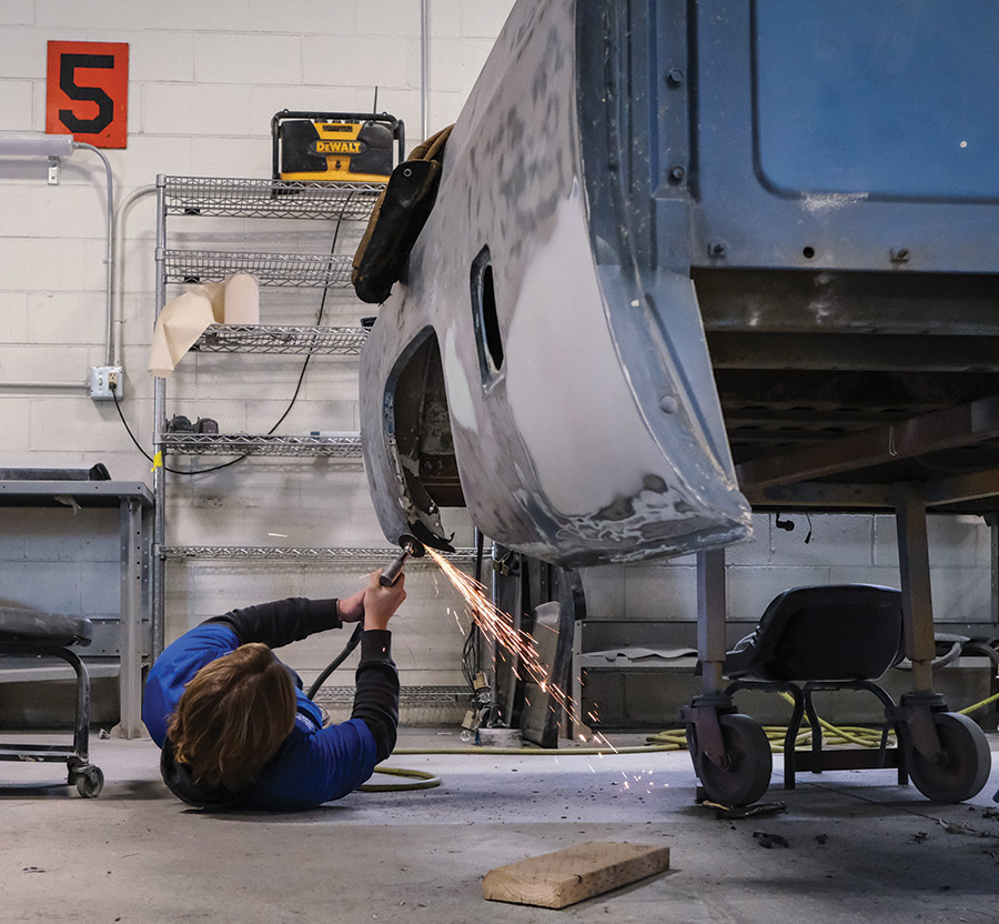 A King Tech student repairs car bodywork in the collision/repair class