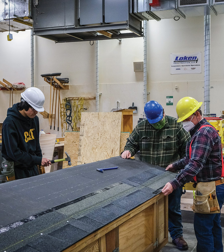 King Tech students learn how to nail roofing material