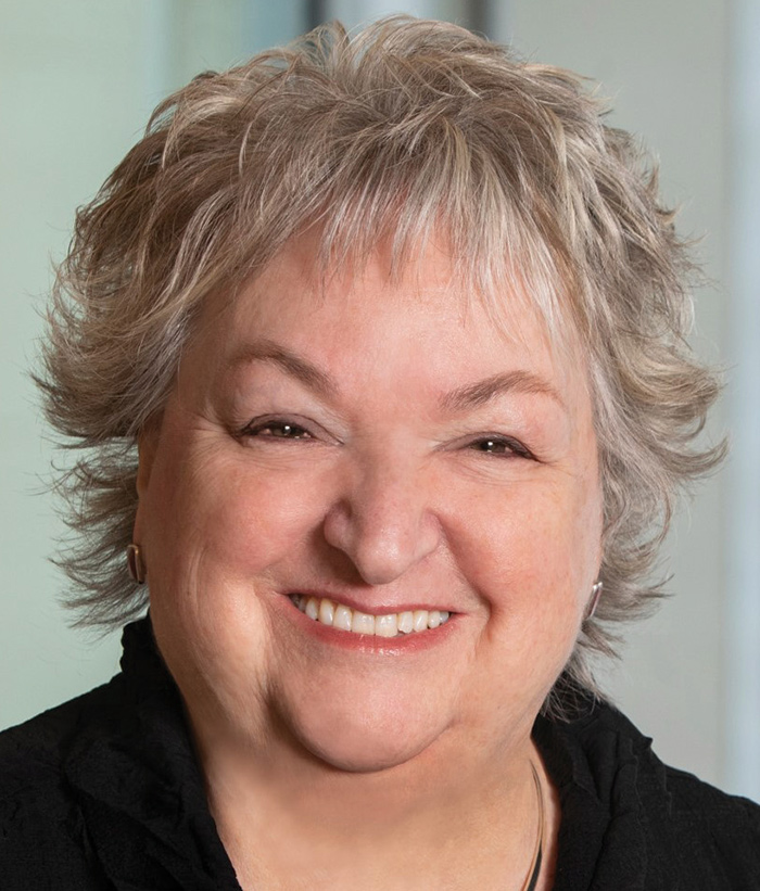 A photograph of Betsy Lawer smiling (President at First National Bank Alaska)