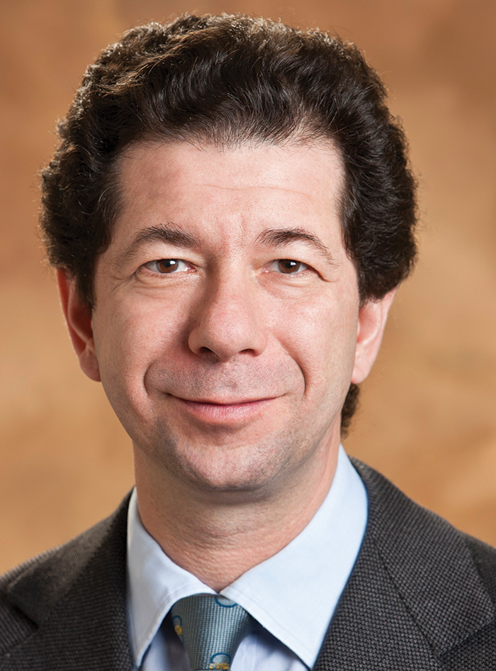 A headshot photograph of Martino Boffa grinning (Director of Sustainability at McKinley Capital Management)