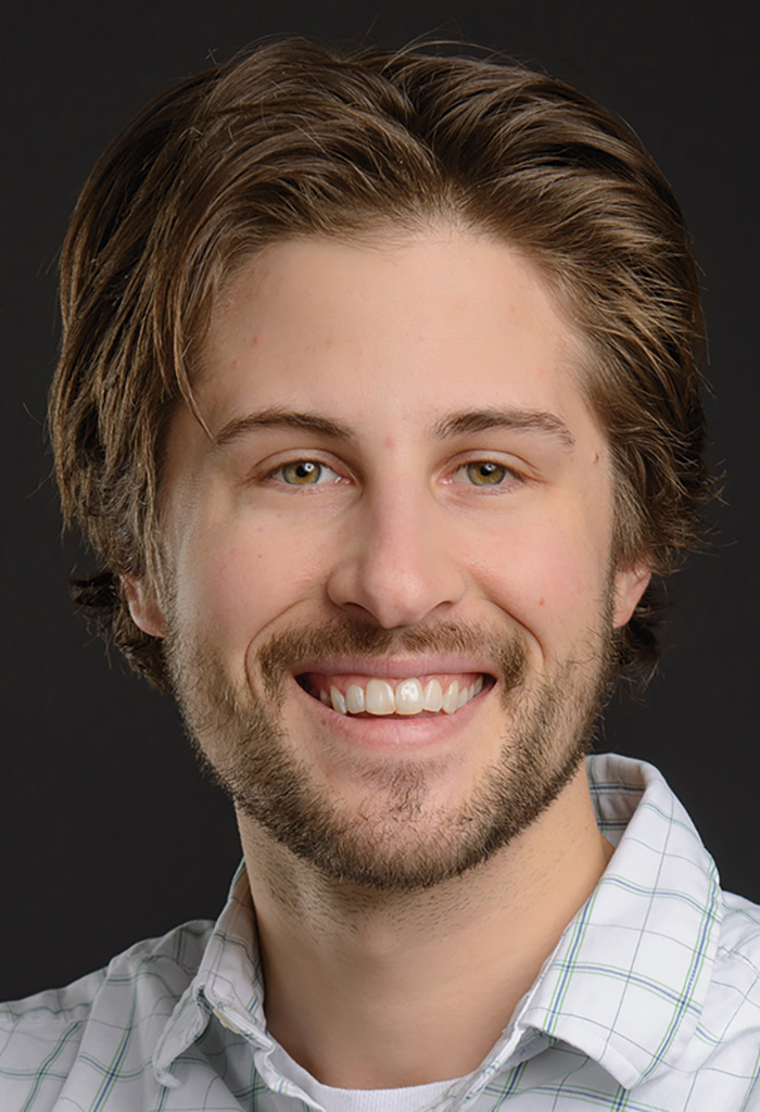 A headshot photograph of Clayton Krueger smiling (Chemical Engineer at Coffman Engineers)