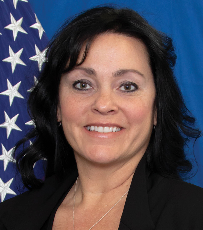 A headshot photograph of Sara Longan smiling (Deputy Chief of the Regulatory Division for the US Army Corps of Engineers)