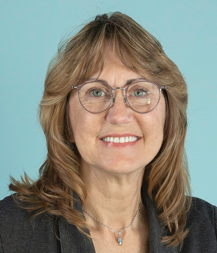 A headshot portrait photograph of Cindy Cevasco smiling