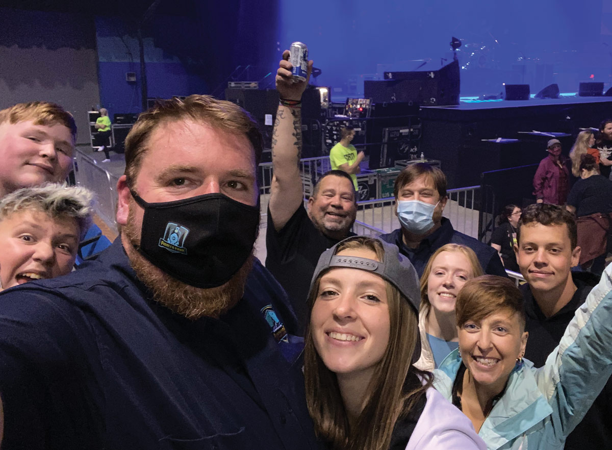 Fairbanks North Star Borough Parks and Recreation Director Donnie Hayes takes a selfie with friends and family before the Foo Fighters concert