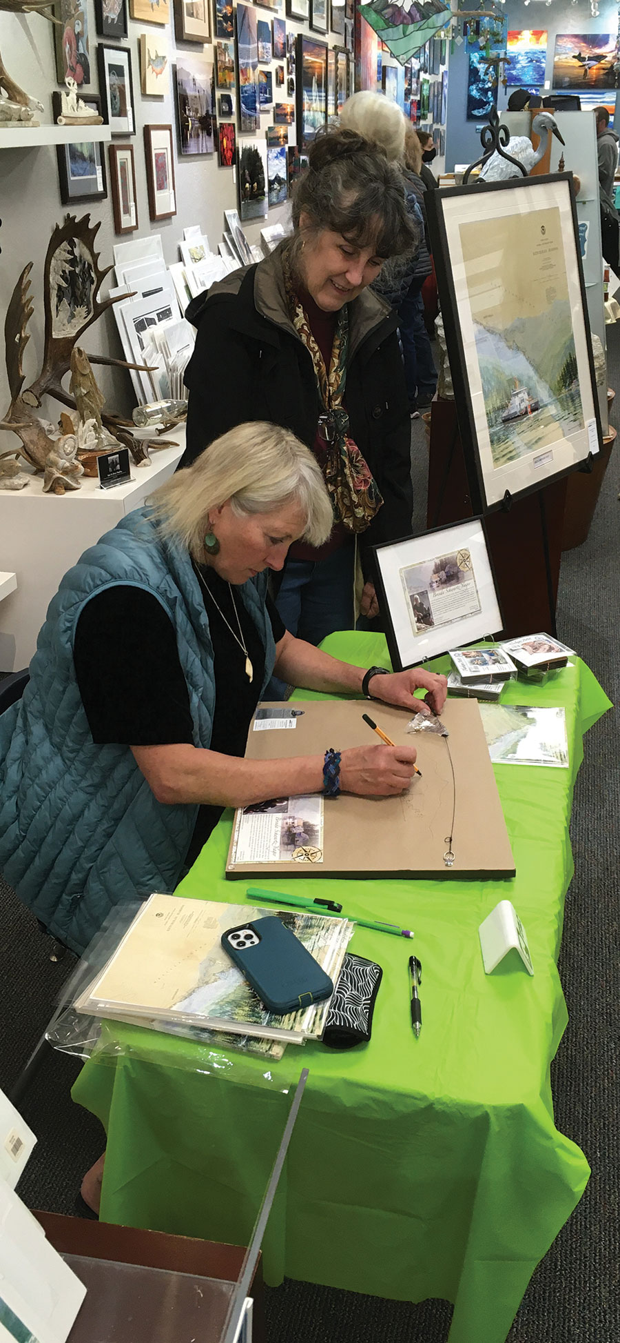 Brenda Schwartz-Yeager customizing a piece at May's First Friday Art Walk and Celebration of the Sea in Ketchikan