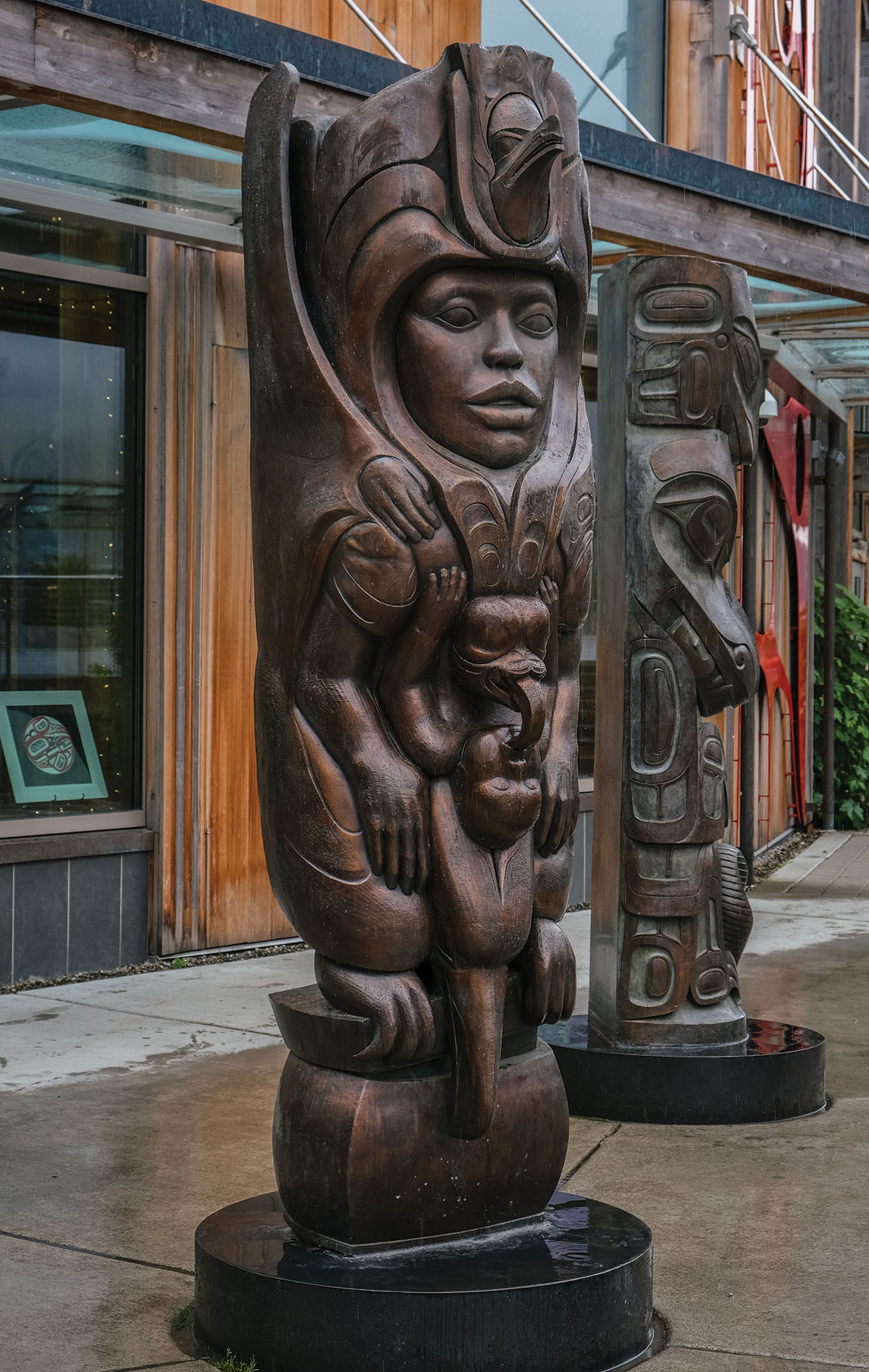 Bronze copies of wooden totem poles outside the Walter Soboleff Building