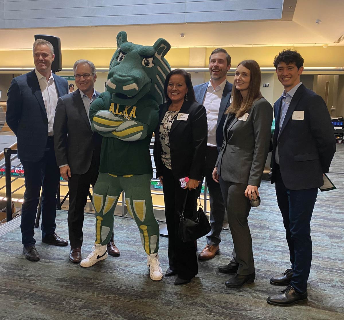 members of team McKinley and UAA standing in UAA's College of Business and Public Policy
