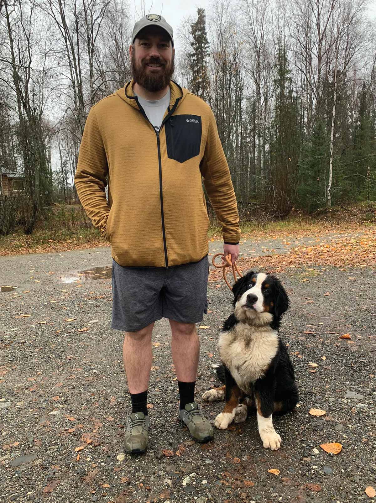 man standing with Midas by his side