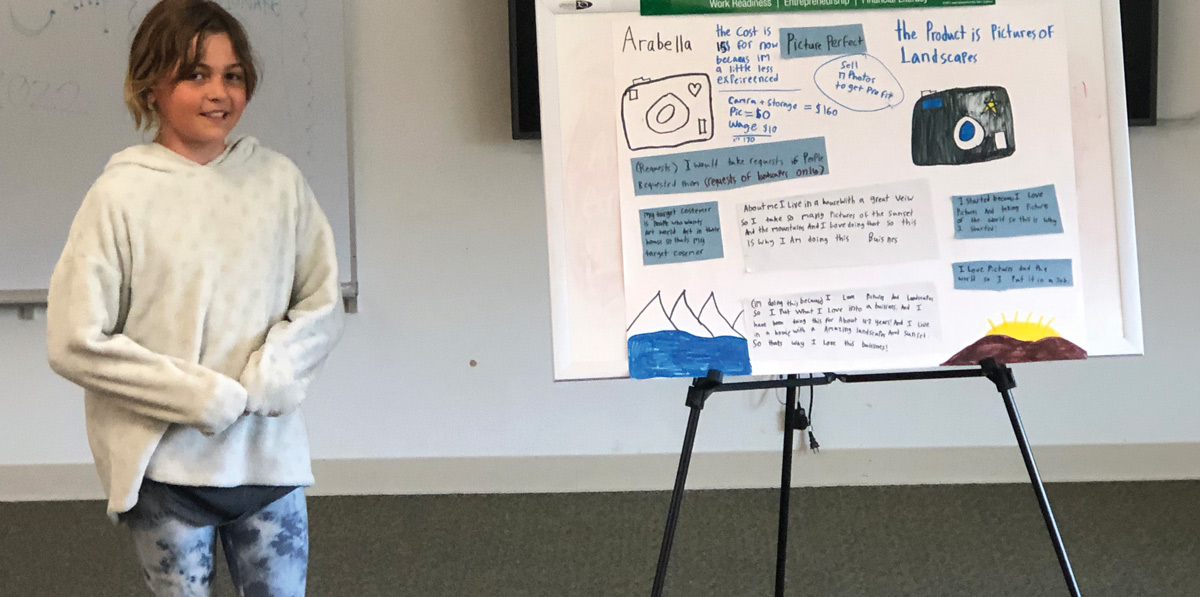 girl giving presentation of her business plan