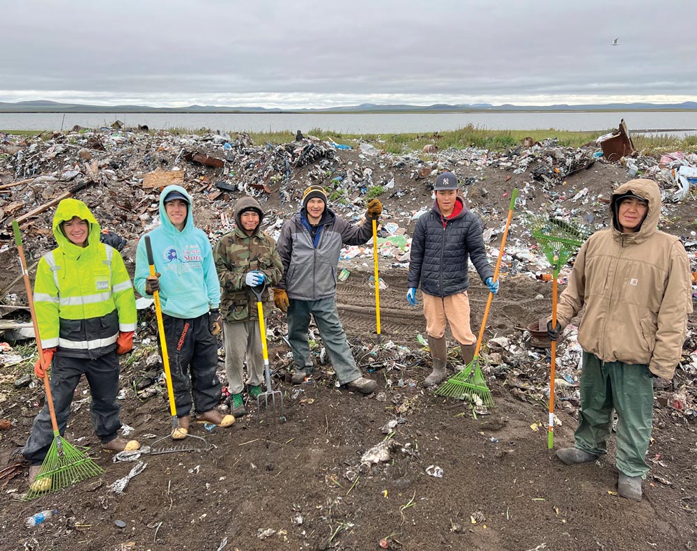 Young volunteers picking up litter