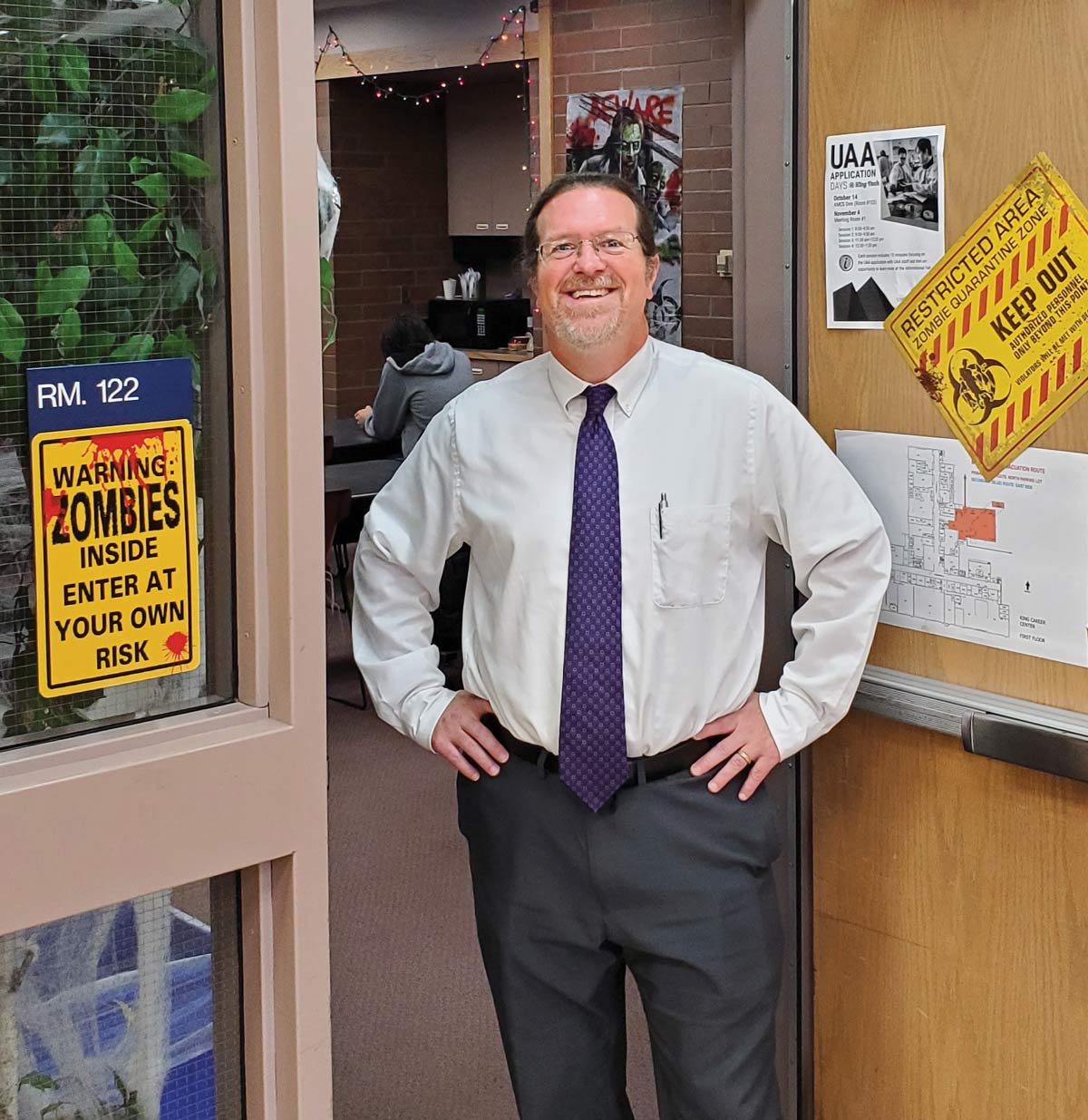 Hecla’s Greens Creek Mine, Northern Star Resources’ Pogo Mine, and Coeur’s Kensington Mine are all underground mines in Alaska Sean Schubert standing at door of classroom