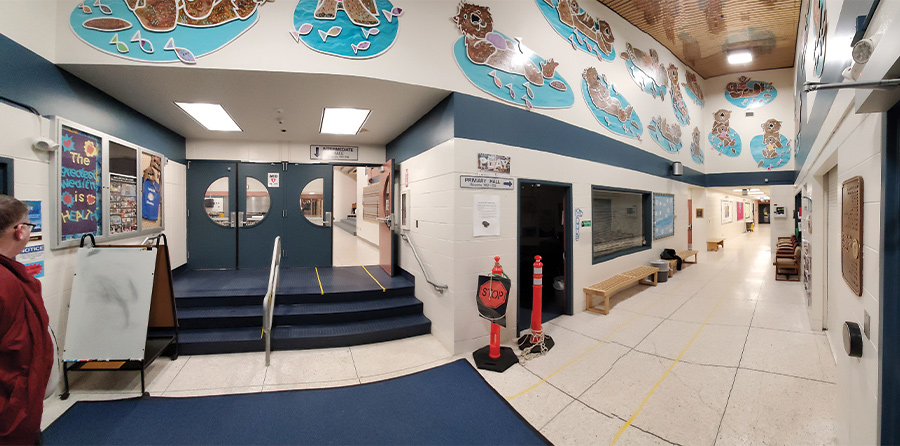 Panoramic views of the entryways of Spring Hill Elementary and Klatt Elementary show how they are mirror images of each other, based on the Anchorage School District’s ‘80s prototype.