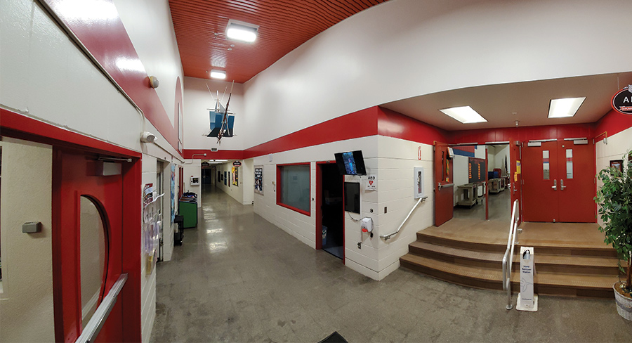 Panoramic views of the entryways of Spring Hill Elementary and Klatt Elementary show how they are mirror images of each other, based on the Anchorage School District’s ‘80s prototype.