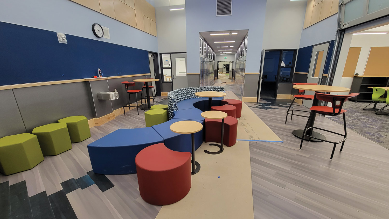 School indoor sitting area with colorful couches