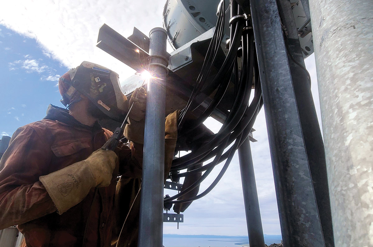 man working on telecommunication tower