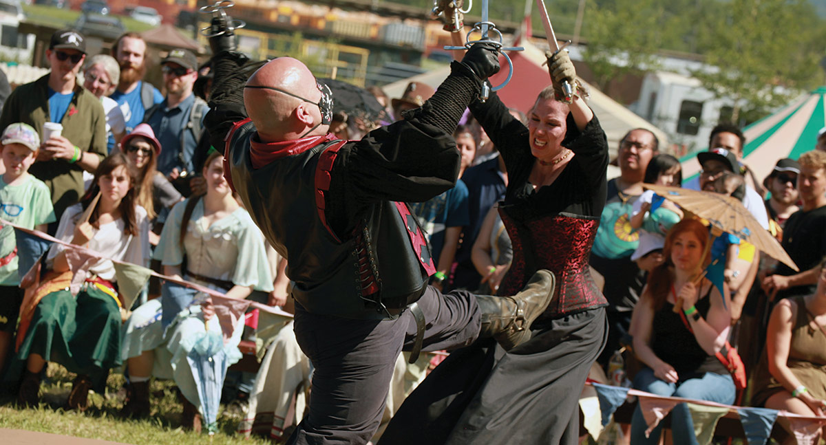 Smiles all around at Peasant Dancing and pretend violence at Fight Show, two of the eighteen performances staged each day of the fair.