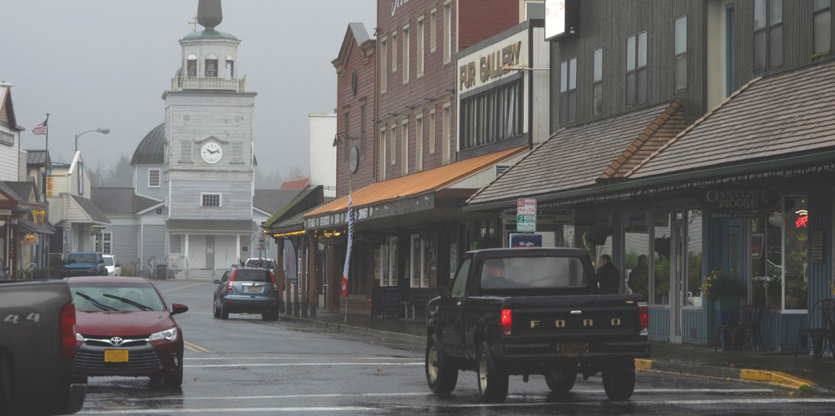 cars driving on wet roads in an Alaskan town