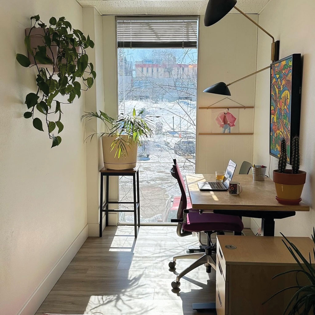 a working station with desk and outdoor scenery behind