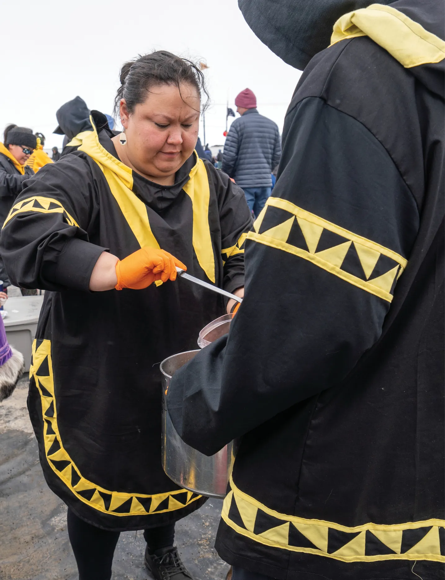 Women and man dressed in festival clothing