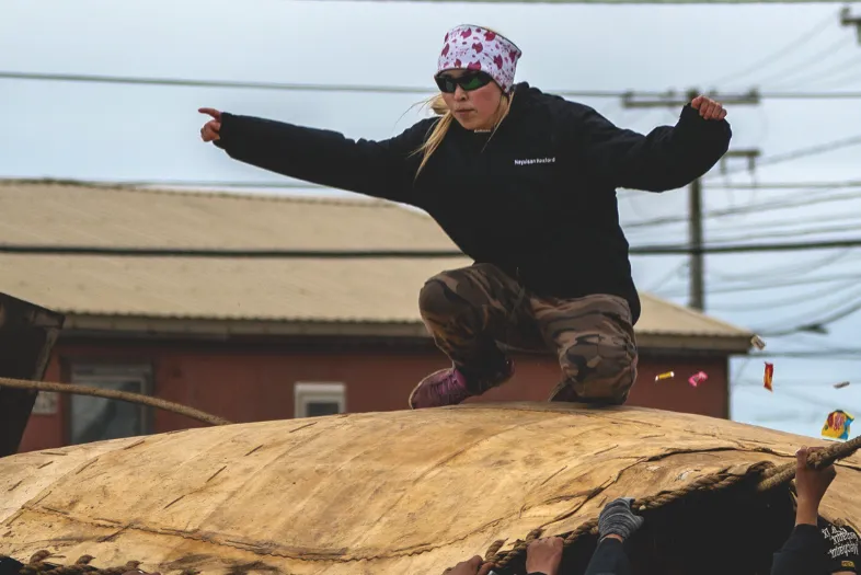 Person kneeling on tarp