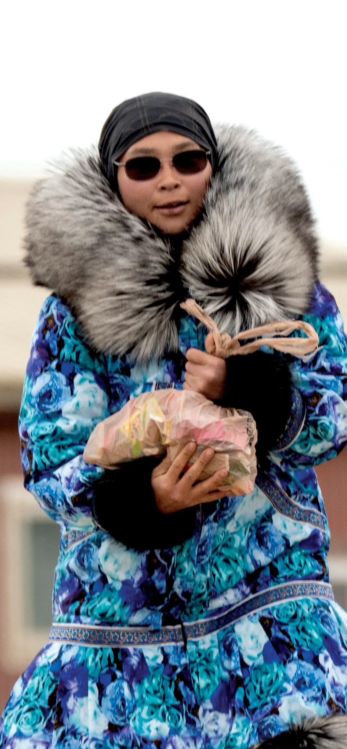 Person holding plastic bag