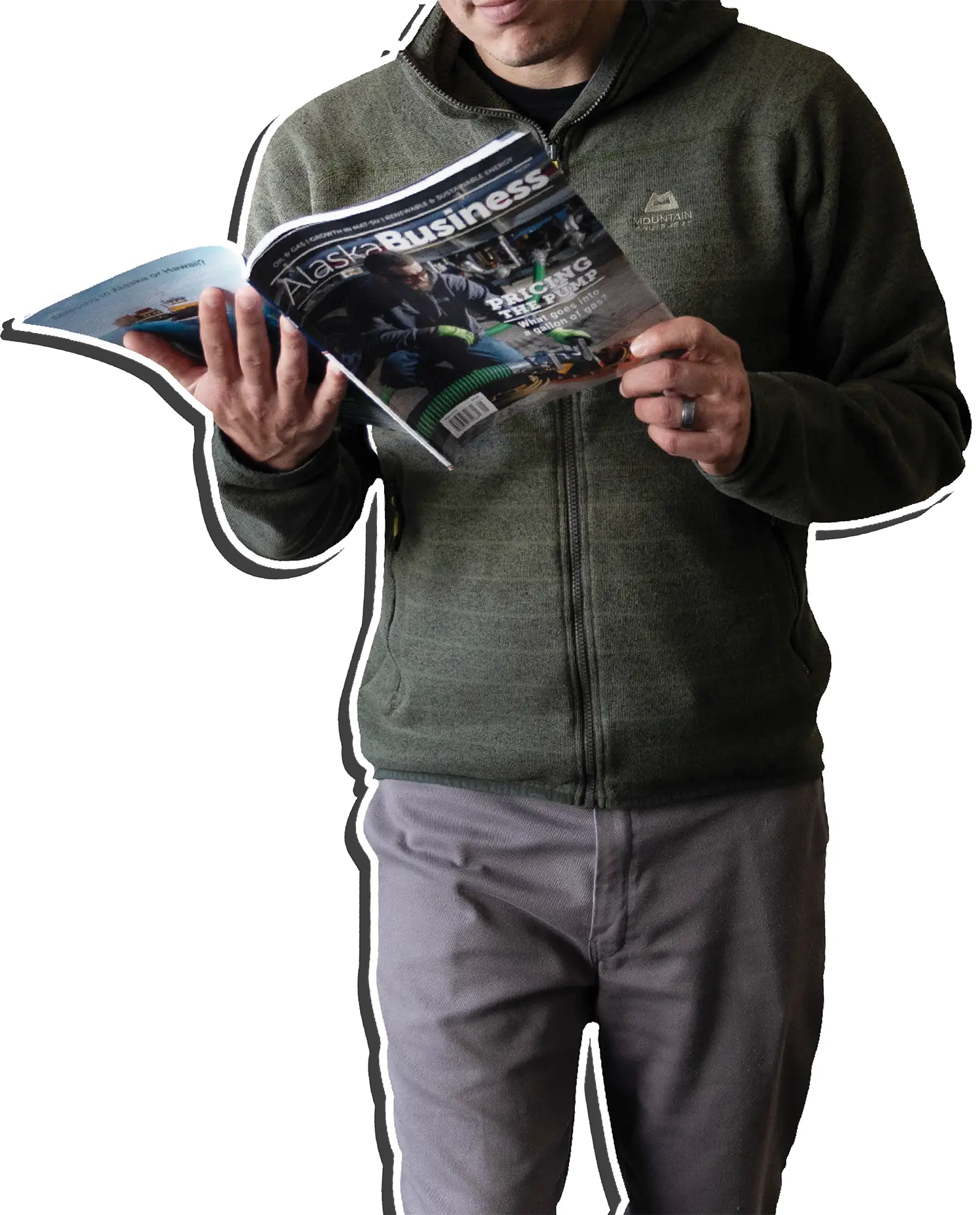 Man walking holding coffee cup in one hand and Alaska Business magazines in the other