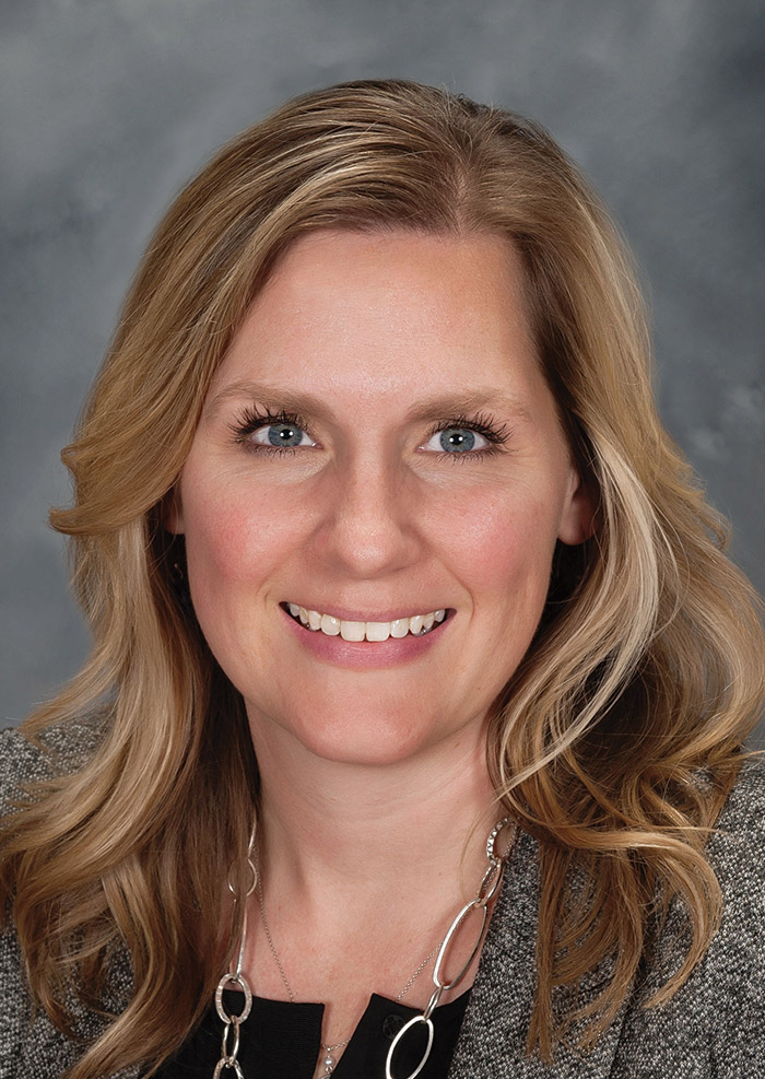 Portrait headshot photograph of Sarah Martin smiling