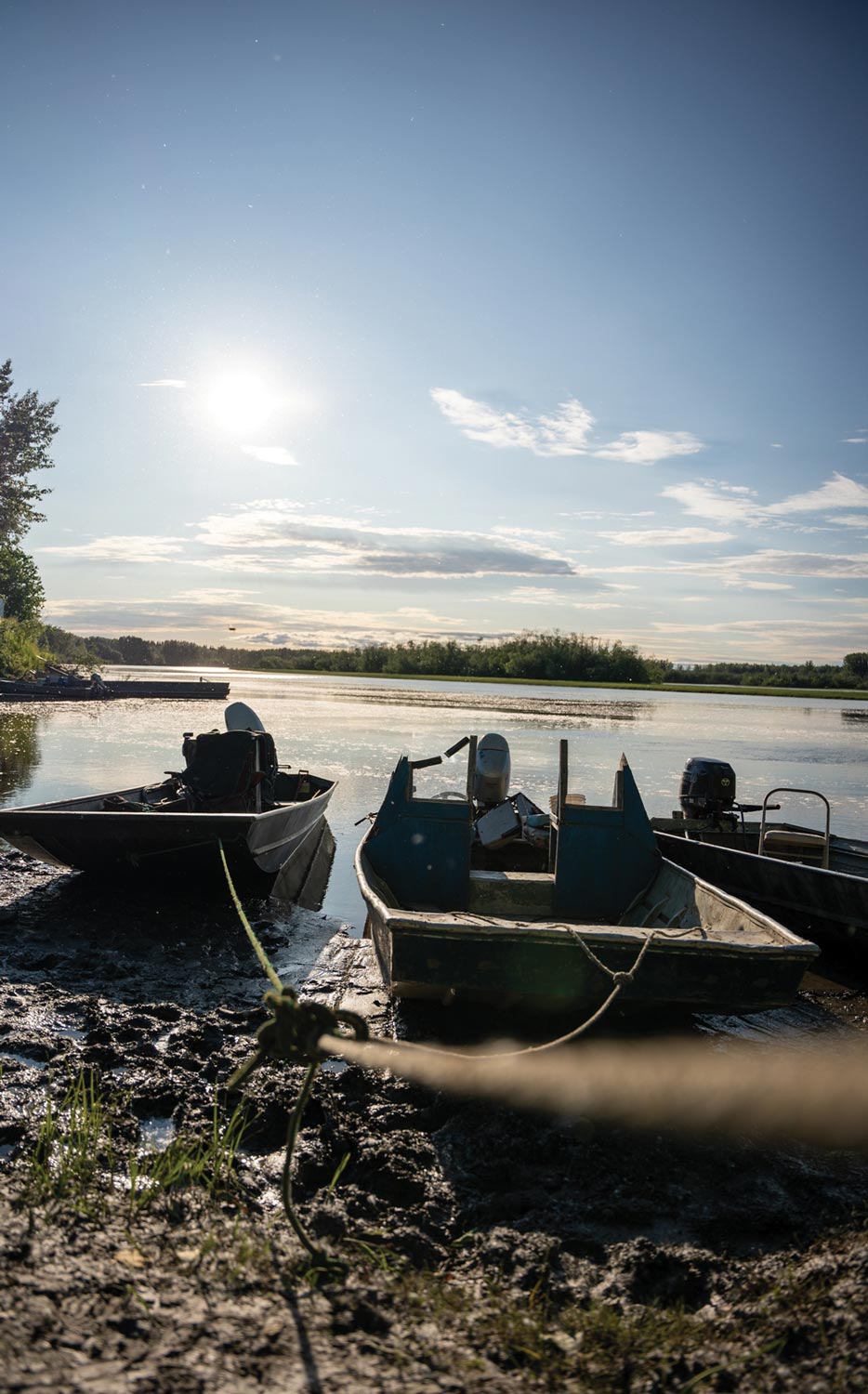 fishing boats sit idle on the shore of the Yukon River