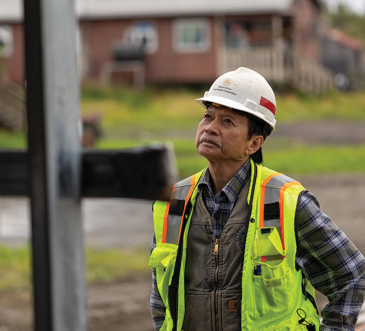 Construction worker in hard hat and yellow vest