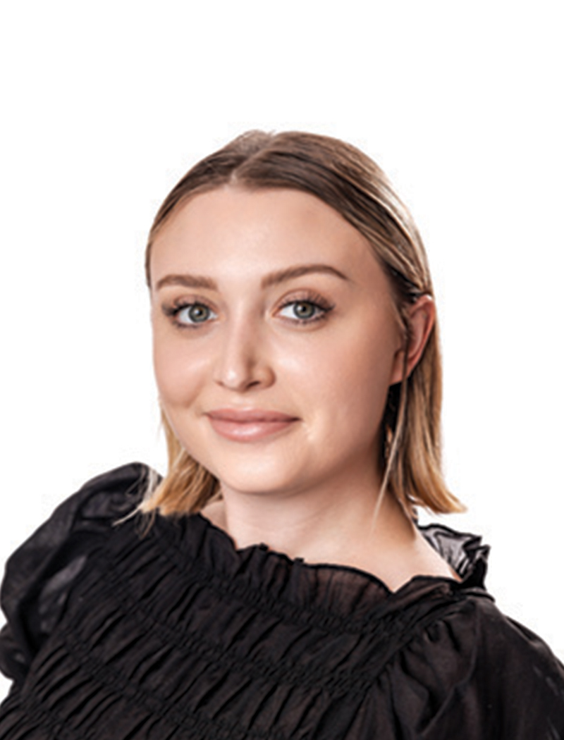 Headshot of a woman with short blonde hair, wearing a black shirt (Sophie Gross)